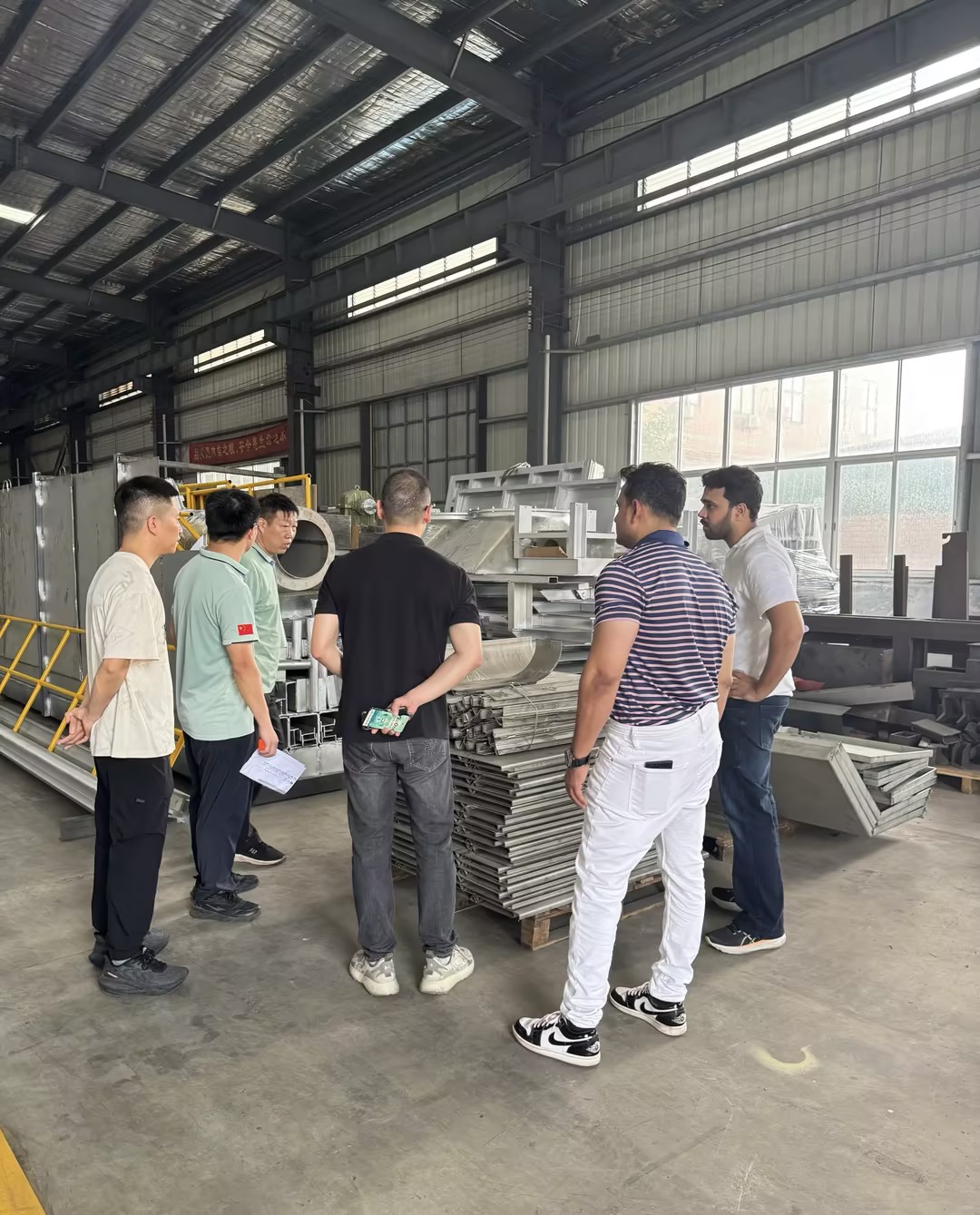 Technical discussion during a factory visit